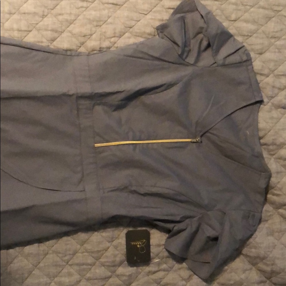 Jaanuu peplum scrub top